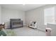 Bedroom featuring carpet floors, gray walls, a crib and a window view at 9537 Crossfield Rd, Avon, IN 46123