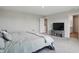 Bright bedroom with large windows, soft carpet, and an ensuite bathroom at 9537 Crossfield Rd, Avon, IN 46123