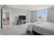 Spacious bedroom with large window views, soft carpet, and attached sitting area at 9537 Crossfield Rd, Avon, IN 46123