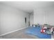 A bright bedroom featuring a blue bed, carpet floors, and walls painted in light gray at 9537 Crossfield Rd, Avon, IN 46123