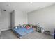 A bedroom with neutral walls and carpet floors, and a cozy blue bed at 9537 Crossfield Rd, Avon, IN 46123