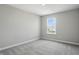 Bright bedroom featuring a window view, neutral walls and carpet floors at 9537 Crossfield Rd, Avon, IN 46123
