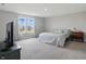 Bright bedroom with large windows and a comfy queen-sized bed and side table at 9537 Crossfield Rd, Avon, IN 46123