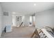 Bright, open bonus room with plush carpet and doorways leading to other rooms at 9537 Crossfield Rd, Avon, IN 46123