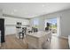 Open kitchen and dining area featuring a large kitchen island and seamless access to the patio at 9537 Crossfield Rd, Avon, IN 46123