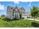 Well-maintained two-story house with manicured lawn and a side view at 9537 Crossfield Rd, Avon, IN 46123