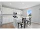 Modern kitchen with white cabinets, a center island, and stainless steel appliances at 9537 Crossfield Rd, Avon, IN 46123