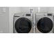 Modern laundry room with new front loading washer and dryer at 9537 Crossfield Rd, Avon, IN 46123