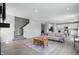 Open concept living area with a staircase, fireplace, and seamless flow to the kitchen at 9537 Crossfield Rd, Avon, IN 46123