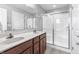 Bathroom showcases double sinks, granite counters, modern fixtures, and tiled floors at 9709 Prairie Smoke Dr, Noblesville, IN 46060