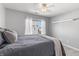 Bright bedroom featuring soft gray walls and large sunlit window at 9709 Prairie Smoke Dr, Noblesville, IN 46060