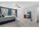 Bright bedroom with a mirror leading to the bathroom at 9709 Prairie Smoke Dr, Noblesville, IN 46060