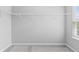 A walk in closet features wire shelving and a window for natural light at 9709 Prairie Smoke Dr, Noblesville, IN 46060