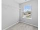 A walk in closet features wire shelving and a window for natural light and street views at 9709 Prairie Smoke Dr, Noblesville, IN 46060