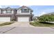 Inviting townhouse showcasing a well-maintained facade and convenient attached garage at 9709 Prairie Smoke Dr, Noblesville, IN 46060