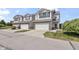 Attractive townhouses with attached garages and neat landscaping create curb appeal at 9709 Prairie Smoke Dr, Noblesville, IN 46060