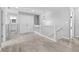 Upstairs landing boasting natural lighting, linen closet, neutral colors and carpet flooring at 9709 Prairie Smoke Dr, Noblesville, IN 46060