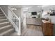 Bright living room featuring a fireplace, high ceilings, and lots of natural light at 9709 Prairie Smoke Dr, Noblesville, IN 46060