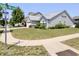 Landscaped front lawn with view of home featuring vinyl siding at 10628 Bali Ct, Noblesville, IN 46060