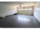 A spacious two car garage with a sealed concrete floor and bright lighting at 10628 Bali Ct, Noblesville, IN 46060