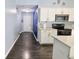 Bright kitchen with white cabinetry, granite countertops, and stainless steel appliances at 10628 Bali Ct, Noblesville, IN 46060