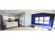 Bright open living room with dark wood floors and modern lighting fixtures at 10628 Bali Ct, Noblesville, IN 46060