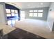 Spacious living room with carpeted flooring and large windows providing natural light at 10628 Bali Ct, Noblesville, IN 46060