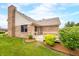 Brick house backyard with well-maintained lawn and lush greenery, perfect for outdoor enjoyment at 1105 Sarah Ct, Greenwood, IN 46142