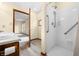 Modern bathroom featuring a walk-in shower with grab bars, wood-look floors, and a vanity sink at 1105 Sarah Ct, Greenwood, IN 46142