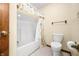 Well-lit bathroom featuring a shower-tub combination and a neutral color scheme, exuding a clean and functional appeal at 1105 Sarah Ct, Greenwood, IN 46142