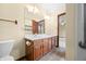 Well-lit bathroom featuring a double vanity with wood cabinets, an ample mirror, and neutral walls at 1105 Sarah Ct, Greenwood, IN 46142