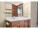 Close-up of the bathroom featuring a double vanity, wood cabinets, and an ample mirror at 1105 Sarah Ct, Greenwood, IN 46142