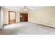 Spacious bedroom with plush carpets, ceiling fan, and access to an ensuite bathroom and closet at 1105 Sarah Ct, Greenwood, IN 46142