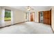 This spacious bedroom features plush carpet, a ceiling fan, and bright light from two windows at 1105 Sarah Ct, Greenwood, IN 46142
