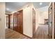 Hallway with hardwood floors and multiple closet doors leading to living areas at 1105 Sarah Ct, Greenwood, IN 46142