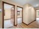 Spacious hallway showcasing wood-look flooring and multiple doorways leading to various rooms, creating a seamless flow at 1105 Sarah Ct, Greenwood, IN 46142
