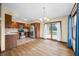 Open-concept kitchen flows to dining area, featuring stainless appliances and natural light at 1105 Sarah Ct, Greenwood, IN 46142