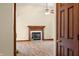 View through doorway to open living area with hardwood floors and fireplace at 1105 Sarah Ct, Greenwood, IN 46142