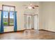 Inviting living room features a bright window, elegant front door, and laminate flooring at 1105 Sarah Ct, Greenwood, IN 46142