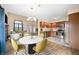Modern open concept showcasing living, dining, and kitchen with updated appliances and laminate floors at 1105 Sarah Ct, Greenwood, IN 46142