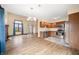 Open floor plan featuring living, kitchen and dining areas with ample lighting and laminate flooring at 1105 Sarah Ct, Greenwood, IN 46142