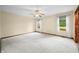 Spacious main bedroom with neutral carpet, ceiling fan, and bright windows at 1105 Sarah Ct, Greenwood, IN 46142