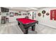 Basement space featuring a pool table, bar, and sports-themed decor for entertaining guests at 1107 Mccray Ln, Westfield, IN 46074