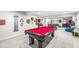 Expansive basement with a red pool table, bar area, and ample recreational space at 1107 Mccray Ln, Westfield, IN 46074