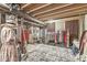 Basement space with hanging racks, shelving, and clothing displays, offering a creative and functional area at 1107 Mccray Ln, Westfield, IN 46074