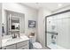 Bathroom featuring a white vanity, decorative mirror, and modern shower at 1107 Mccray Ln, Westfield, IN 46074