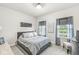 Cozy bedroom with natural lighting, neutral decor, and calming colors at 1107 Mccray Ln, Westfield, IN 46074