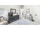 Bright bedroom featuring a dresser, soft carpet, and neutral decor creating a relaxing atmosphere at 1107 Mccray Ln, Westfield, IN 46074