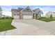 Well-maintained home exterior featuring a three car garage and inviting front porch at 1107 Mccray Ln, Westfield, IN 46074