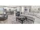 Open-concept living room connected to kitchen, featuring modern decor and comfortable seating at 1107 Mccray Ln, Westfield, IN 46074